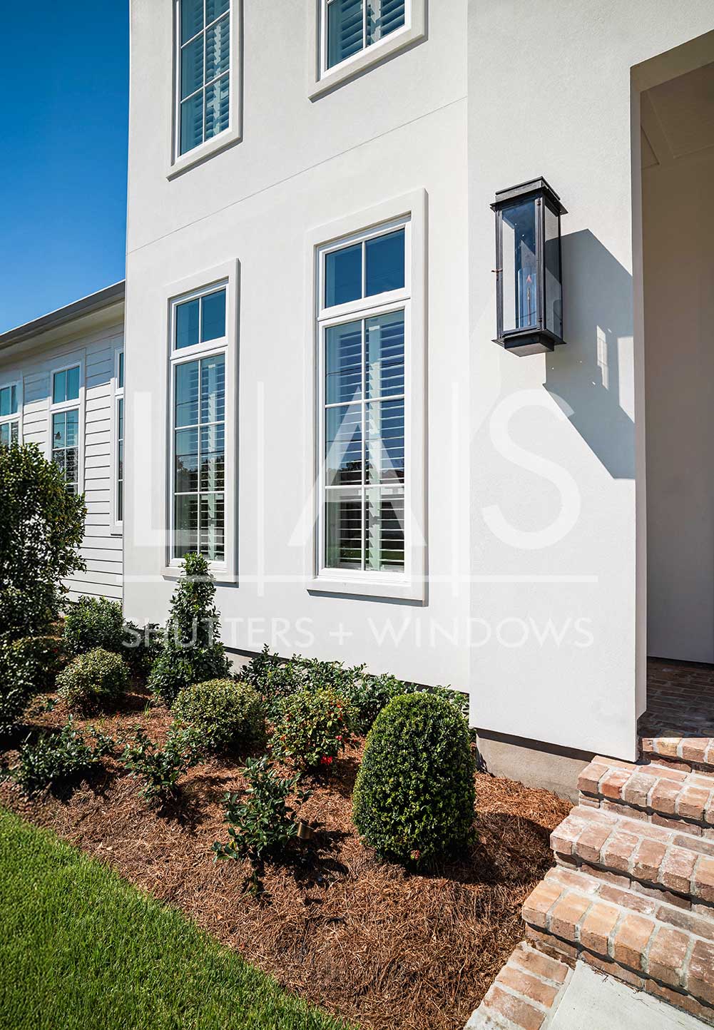A modern home featuring stylish, energy-efficient windows by LAS Shutters + Windows.